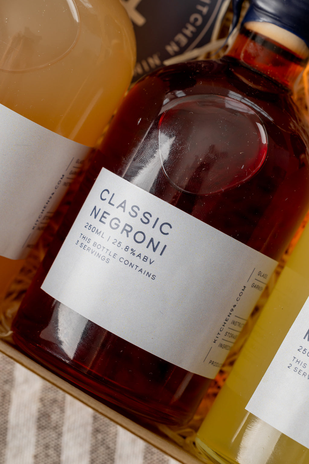 Kitchen 94 cocktail sample bottles with branded packaging